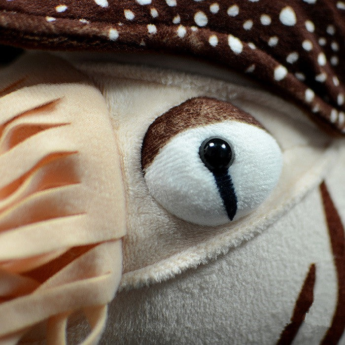 a stuffed animal with a mushroom hat