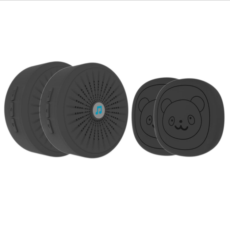 a group of round black objects with a cartoon bear face