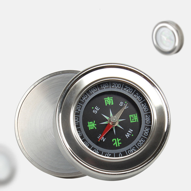 a compass with a black face