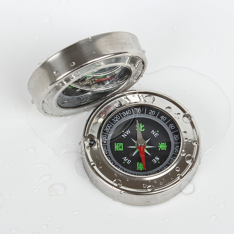 a compass with water drops on it