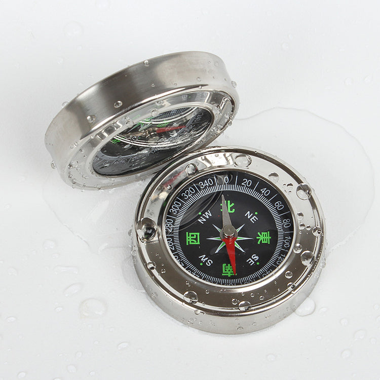 a compass with water drops on it