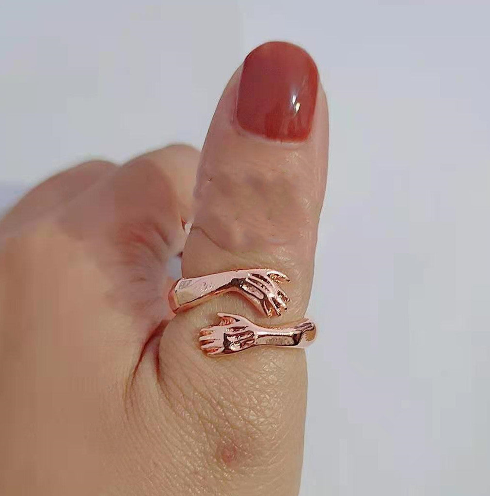 a hand with a ring on it