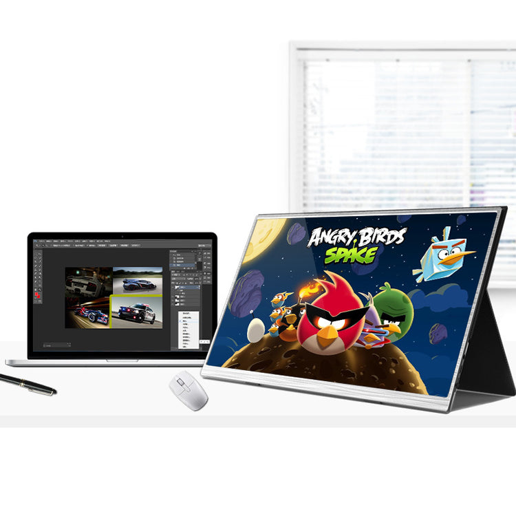 a computer screen and a pen on a desk