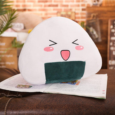 a white pillow with a face on top of a book