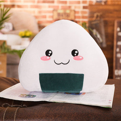 a white pillow with a face on top of a book