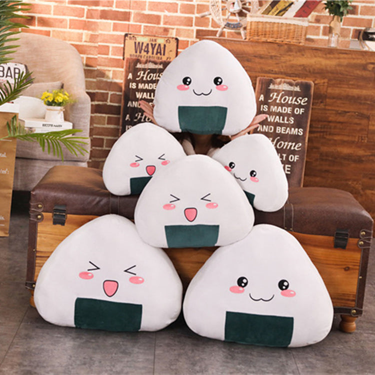 a group of pillows on top of a pile of wood