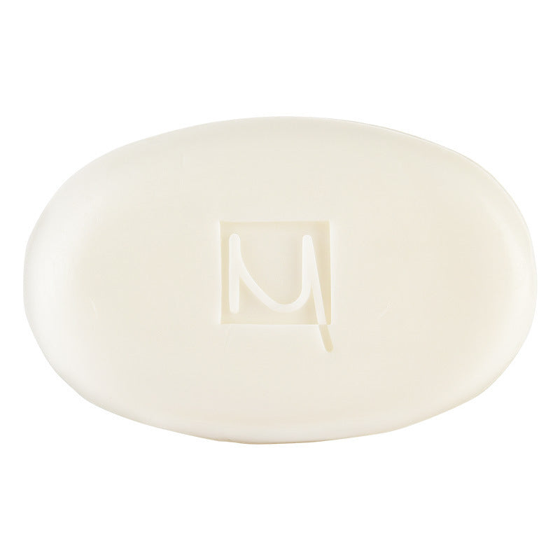 a white soap with a letter on it