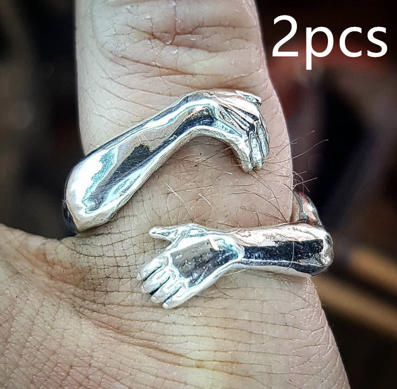 a silver ring on a person's finger