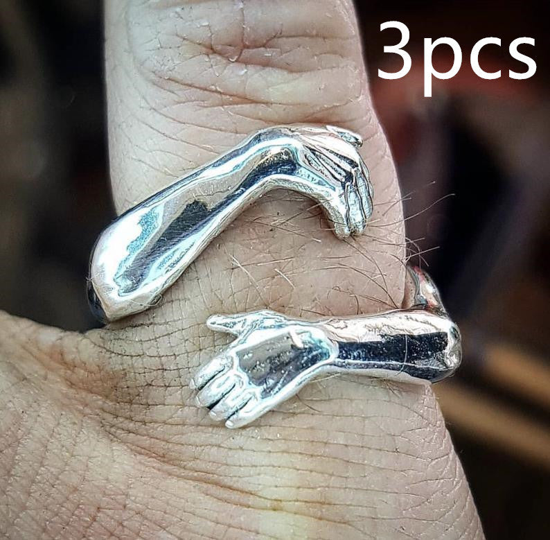 a silver ring on a person's finger