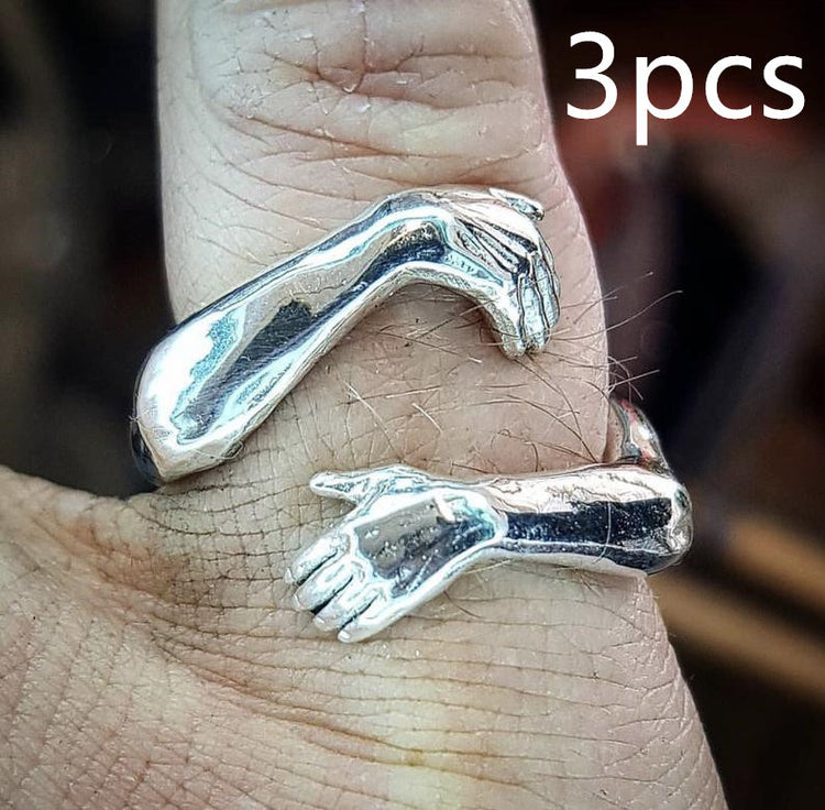 a silver ring on a person's finger