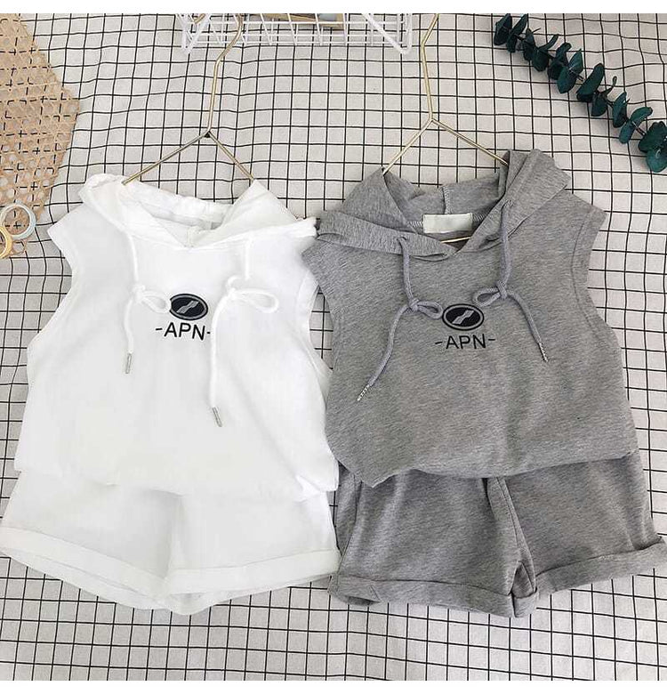 a white and grey vest and shorts