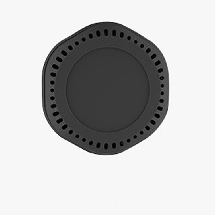 a black circular object with holes