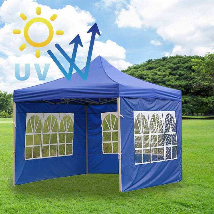 a blue tent in a field