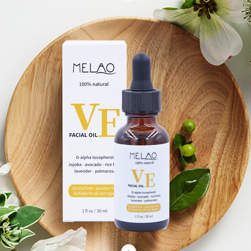 a bottle of facial oil on a plate