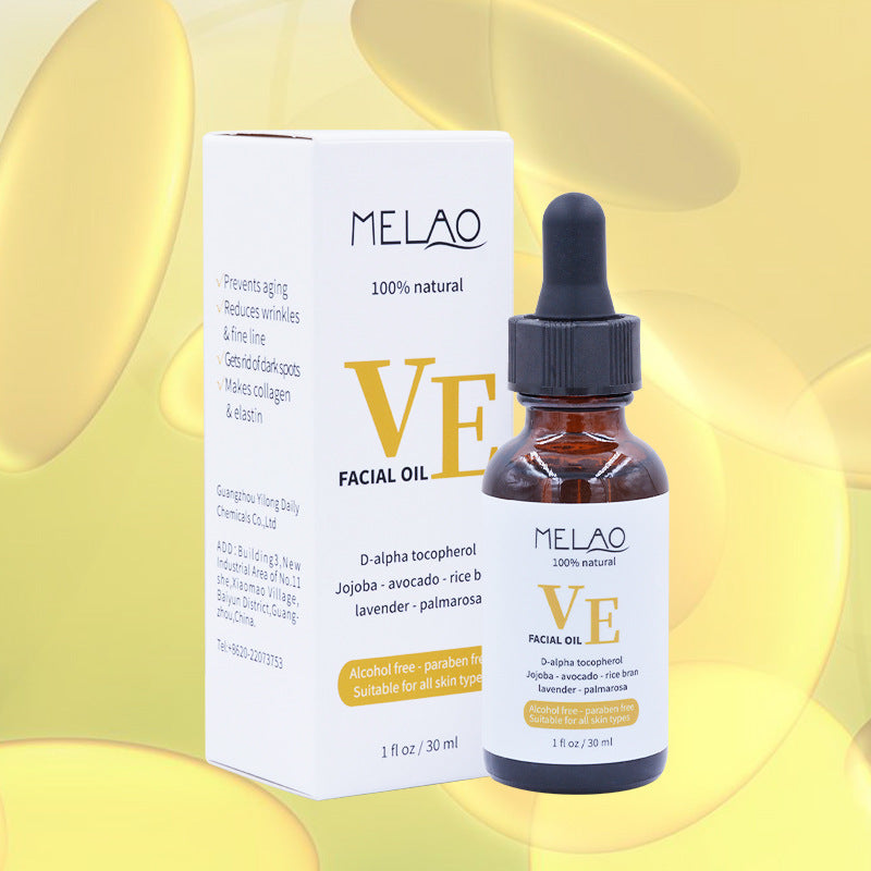 a bottle of facial oil with a box