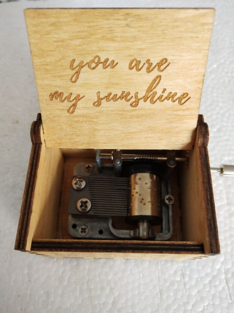a small wooden box with a message