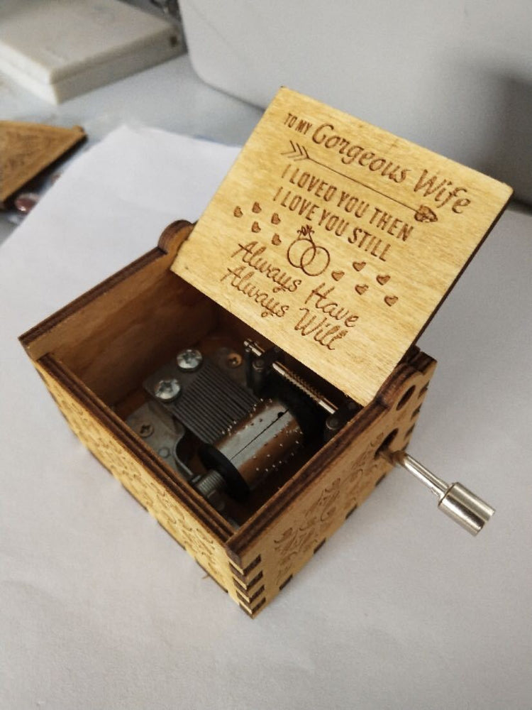 a wooden music box with a music box