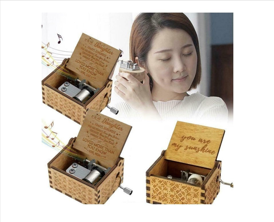 a woman holding a music box