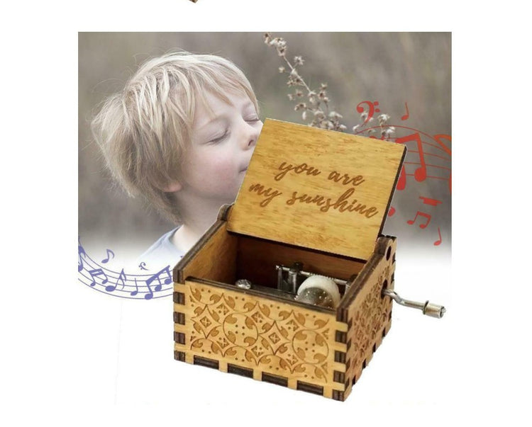 a wooden music box with a child in the background