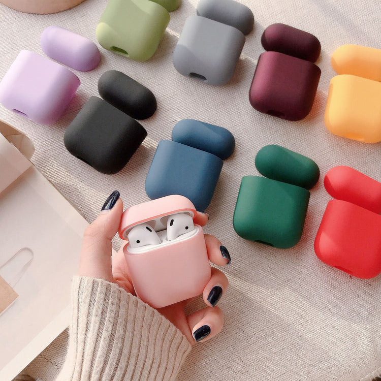 a hand holding a case with a couple of colorful cases