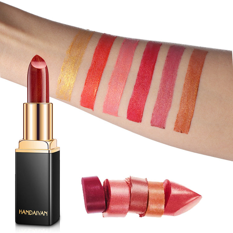 a hand with lipstick and lipstick samples