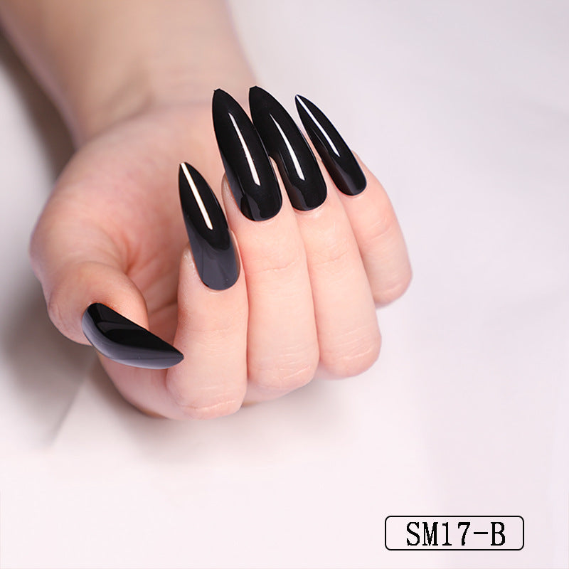 a hand with long black nails
