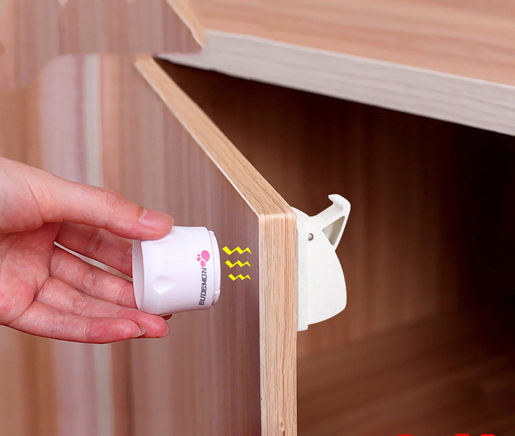 a hand holding a white object