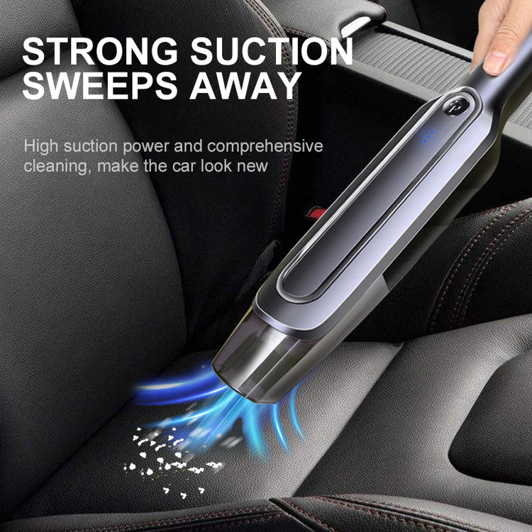 a hand holding a vacuum cleaner