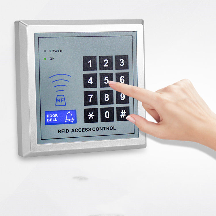 a hand pressing a keypad