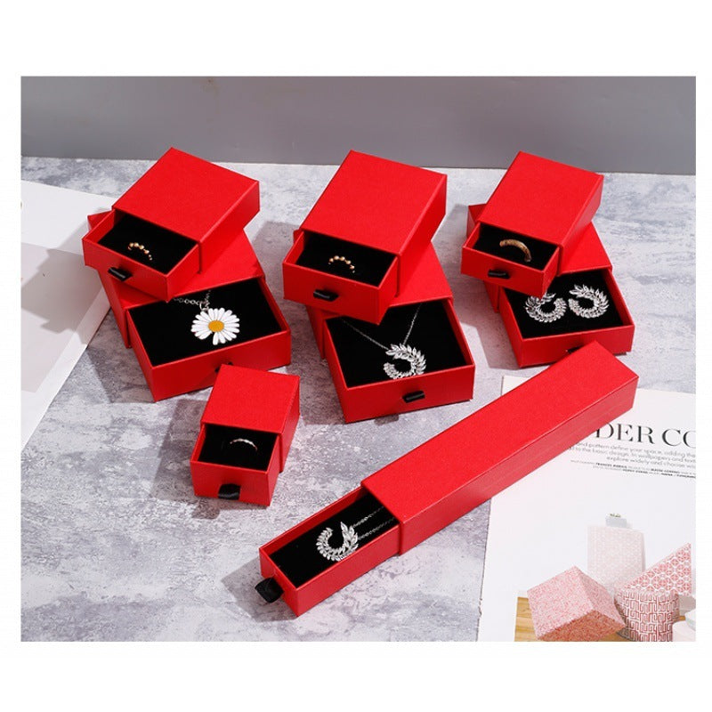 a red box with jewelry in it
