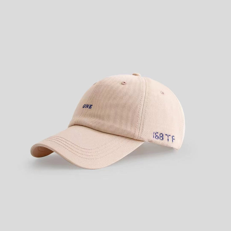 a beige hat with blue text