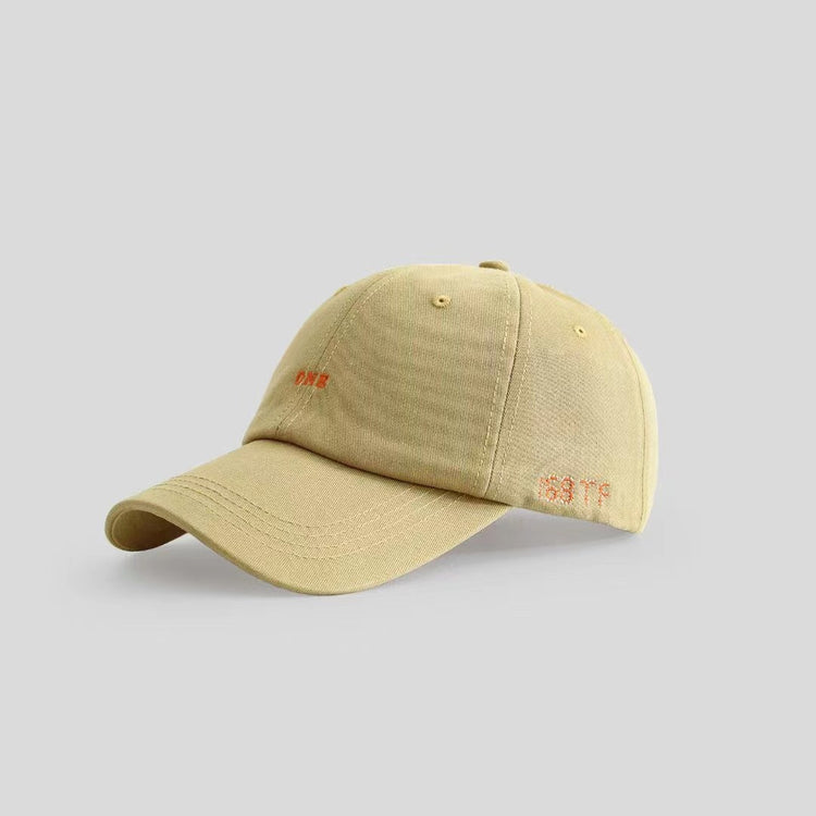 a tan baseball cap