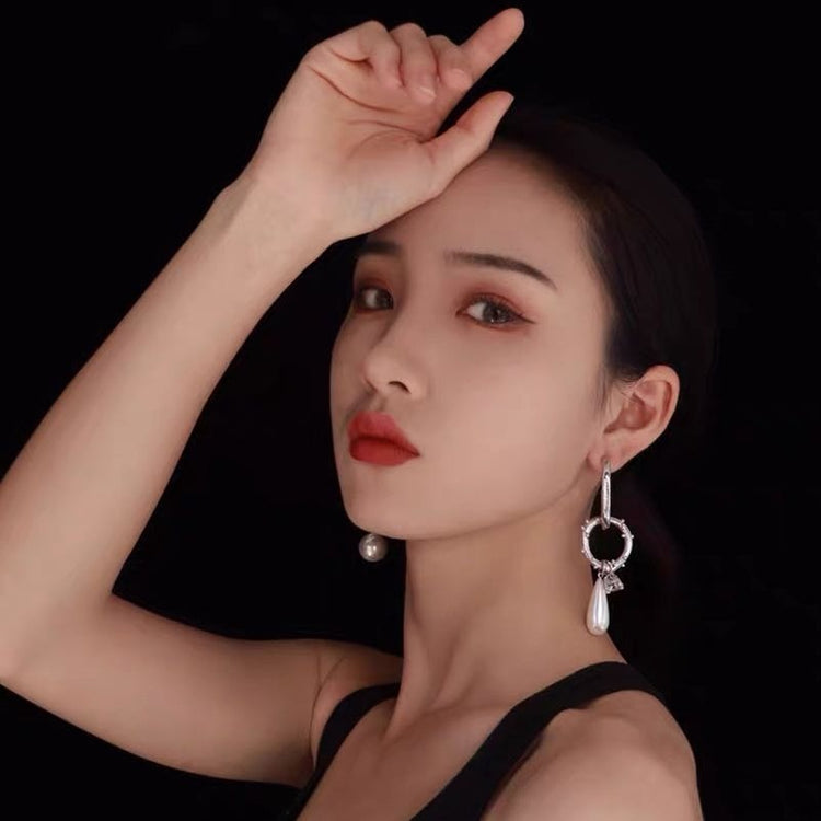 a woman with her hand on her forehead