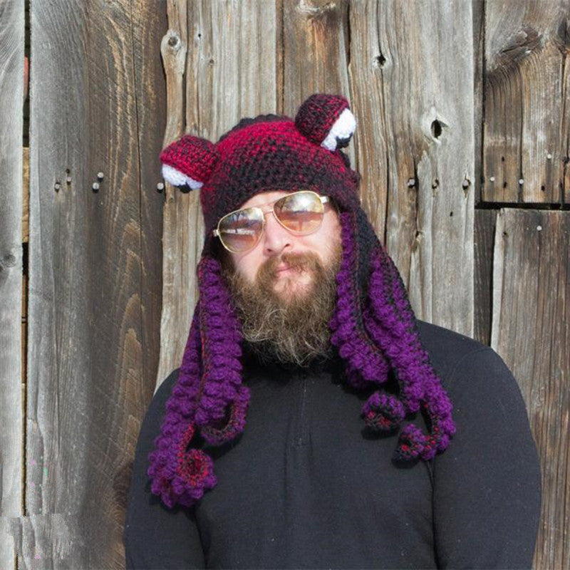a man wearing a hat and sunglasses