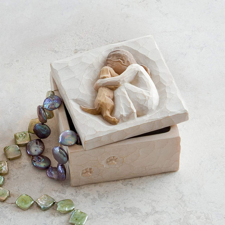 a wooden box with a bead on top