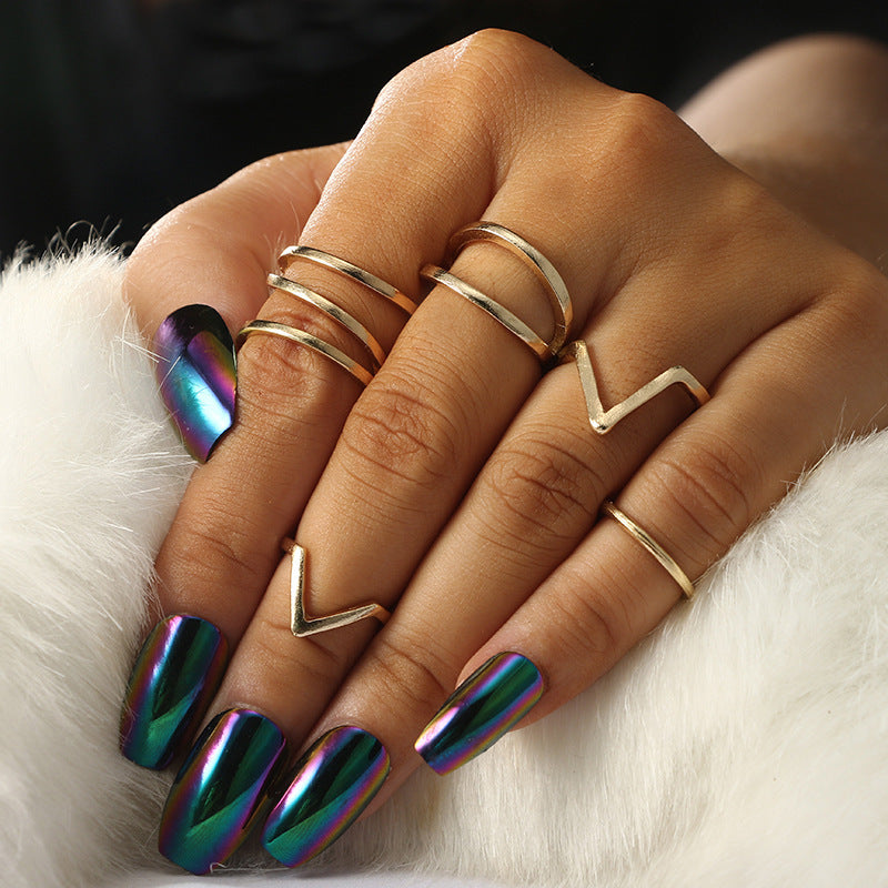 a hand with different rings on it