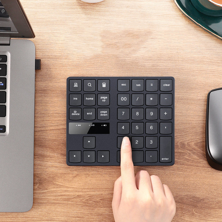 a finger pressing a keyboard