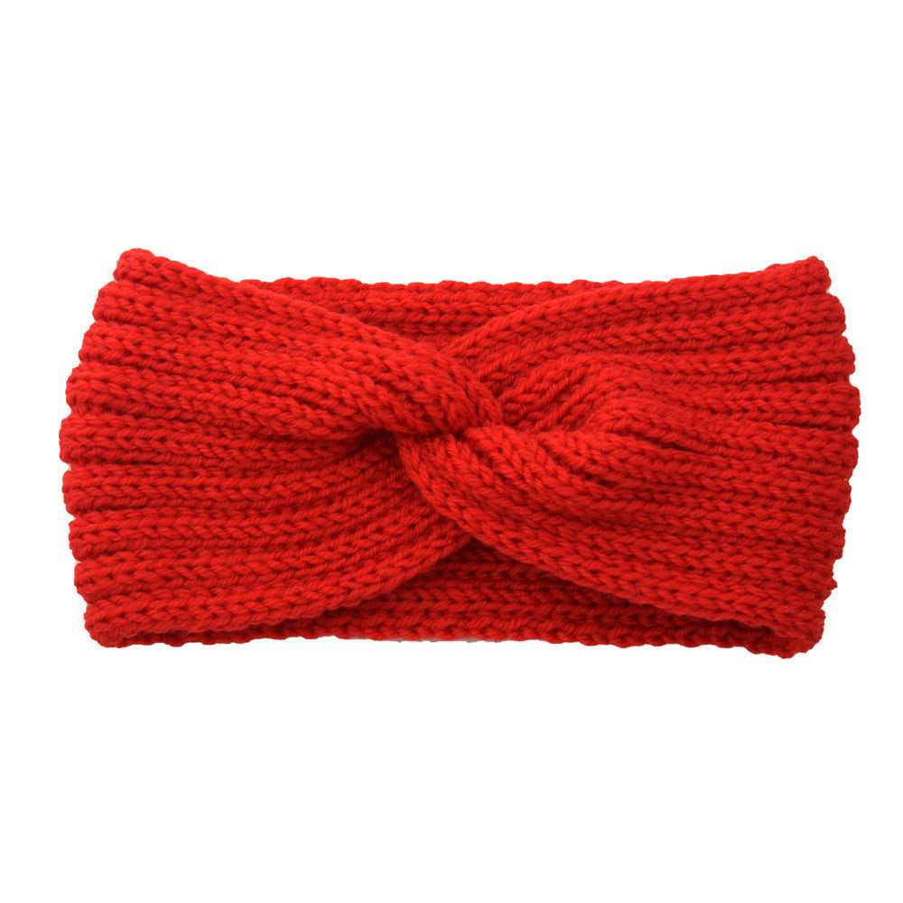 a red knit headband with a knot