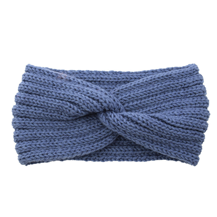 a blue knit headband with a knot