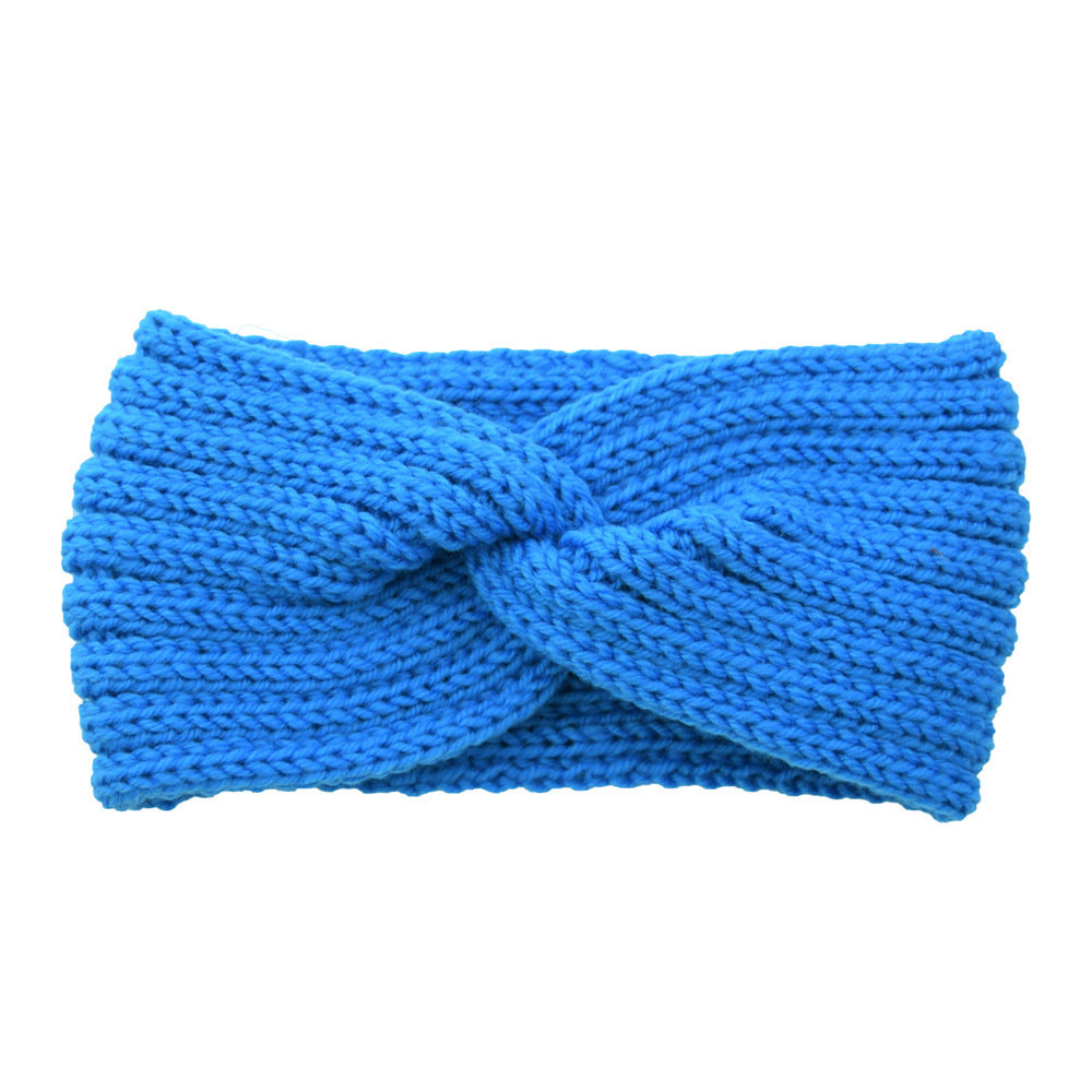 a blue knit headband with a knot