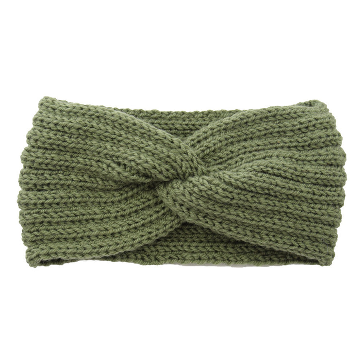 a green knit headband with a knot