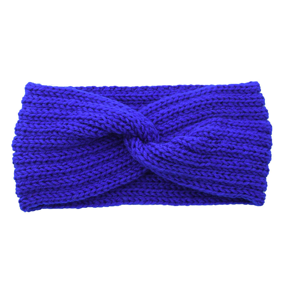 a blue knit headband with a knot