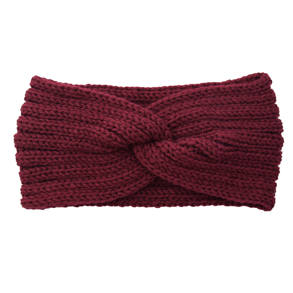 a red knit headband with a knot