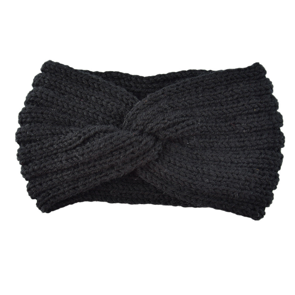 a black knit headband with a knot