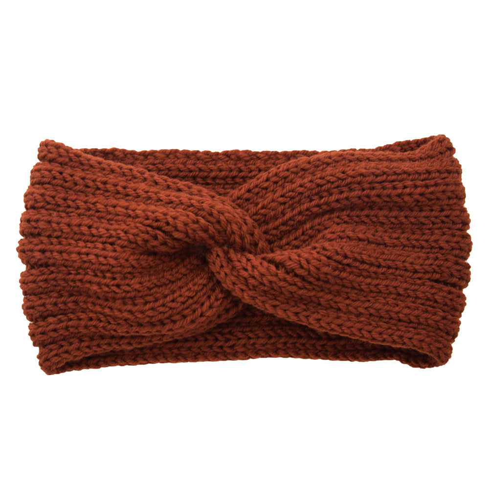 a brown knit headband with a knot