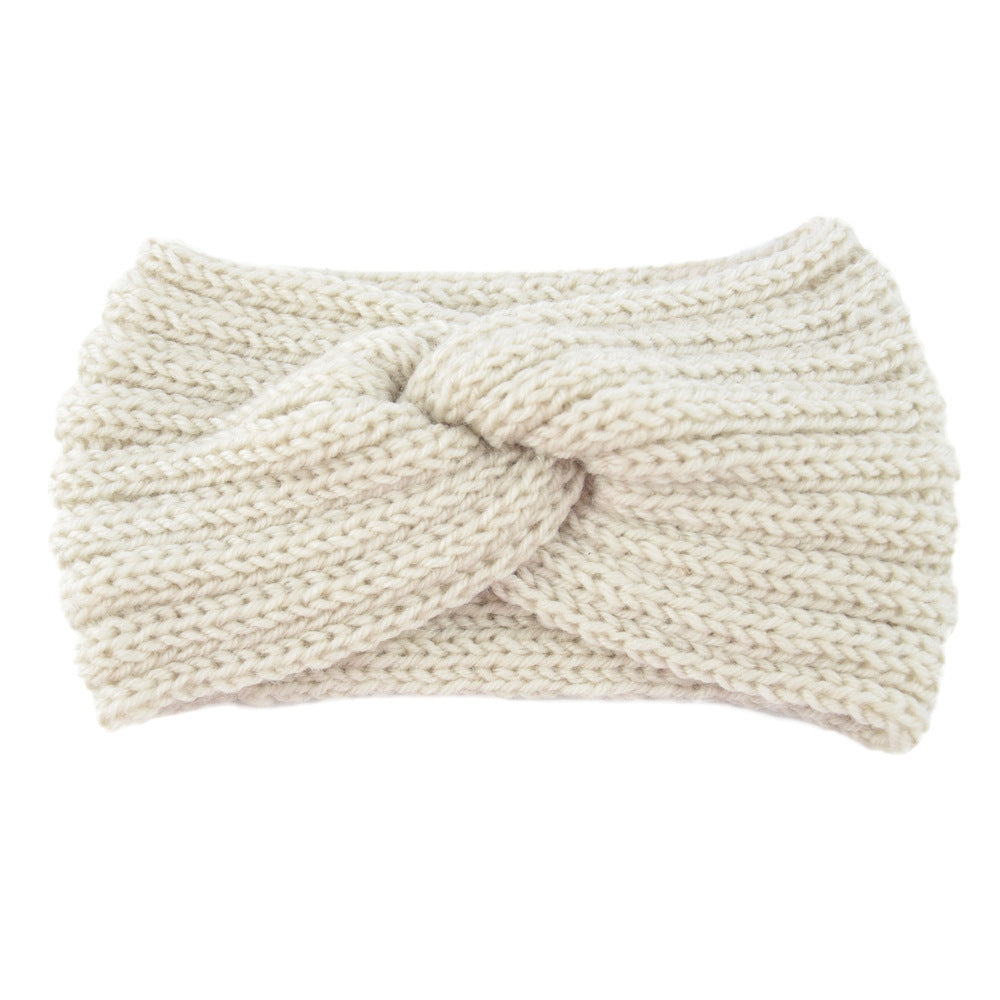 a white knit headband with a knot