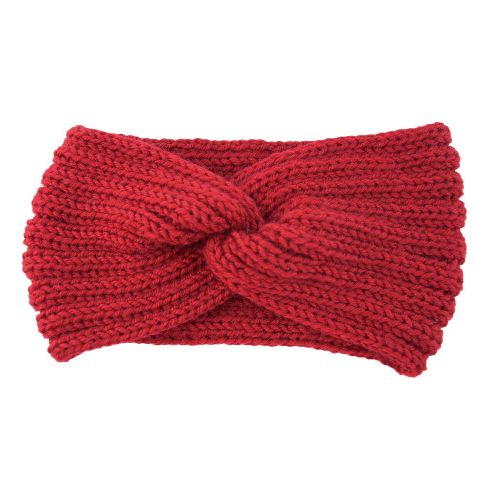 a red knit headband with a knot