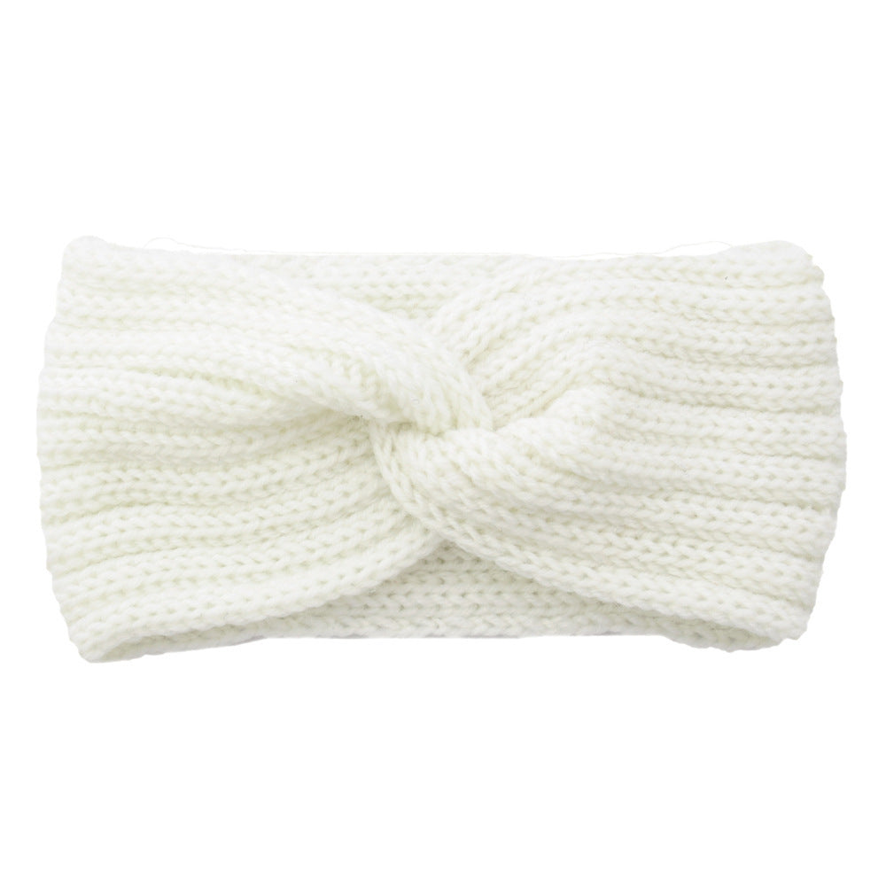 a white knit headband with a knot