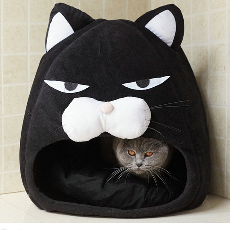 a cat in a cat shaped pillow
