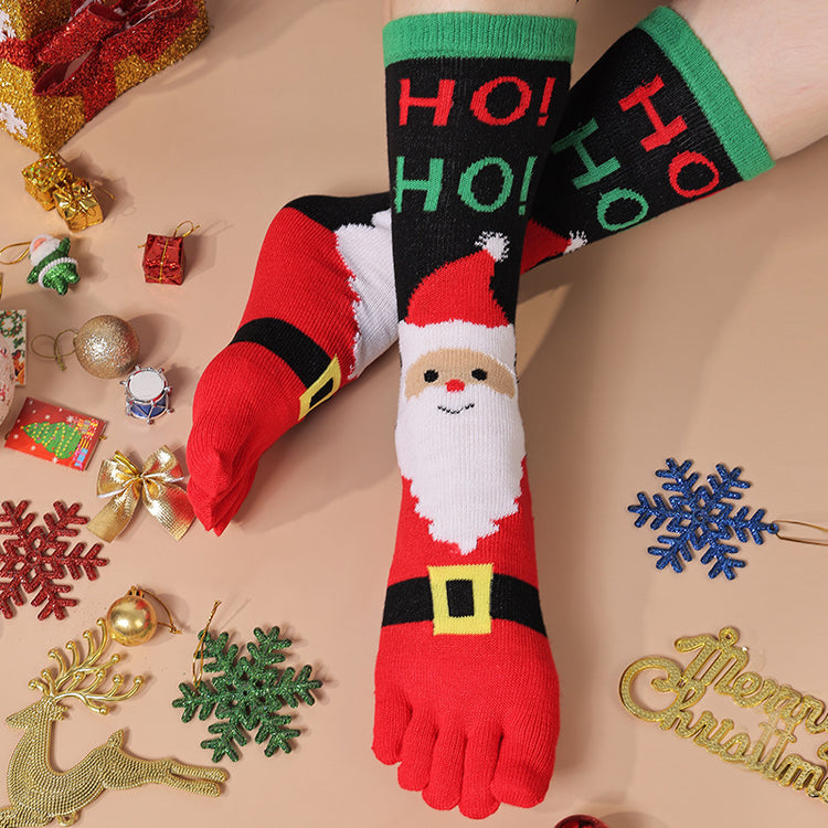 a person's feet wearing socks with santa claus and snowflakes